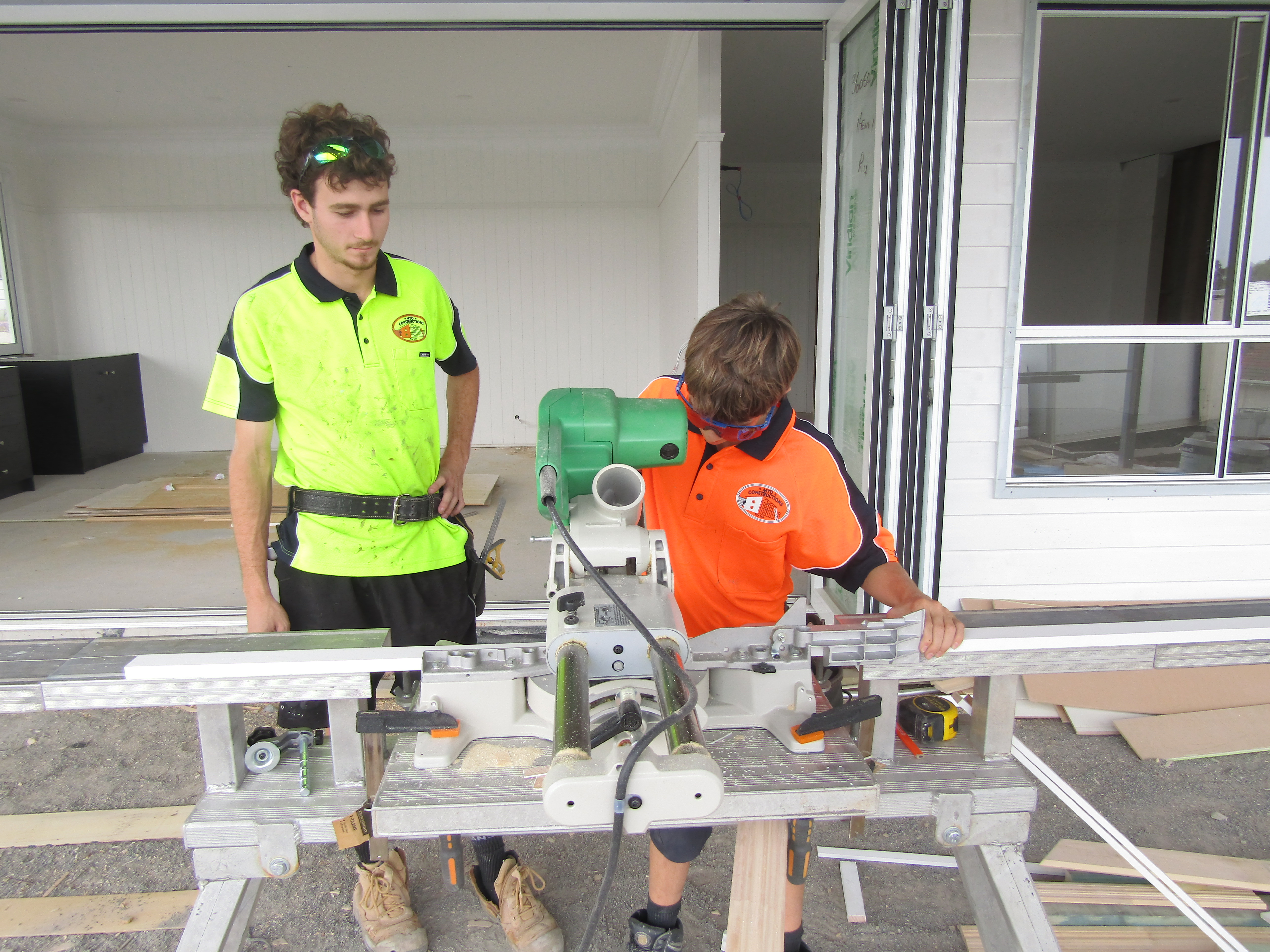Student being taught on a construction site.