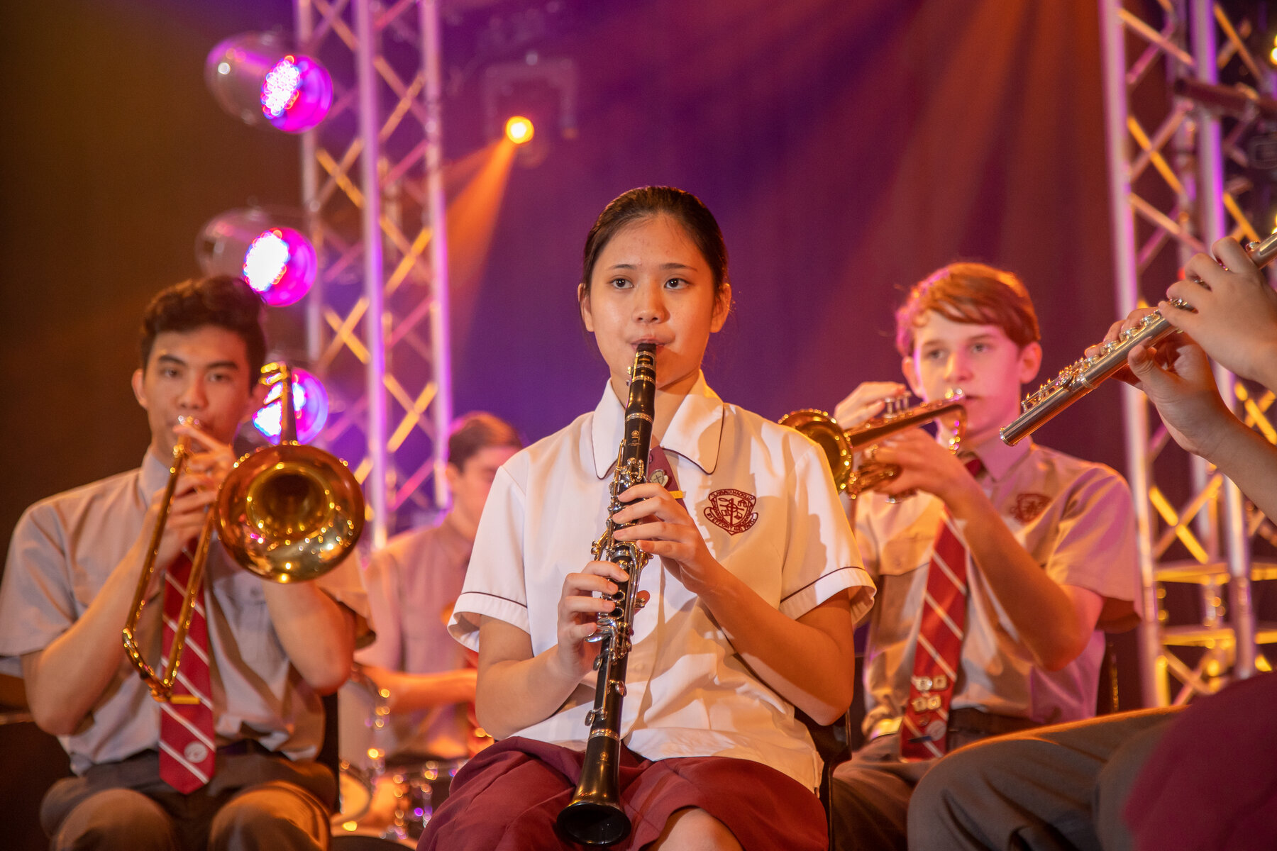 Students playing instruments during a performance.