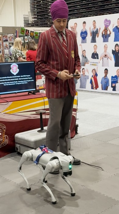 Student with a robot dog.