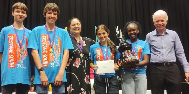 Four STEM students receiving awards.